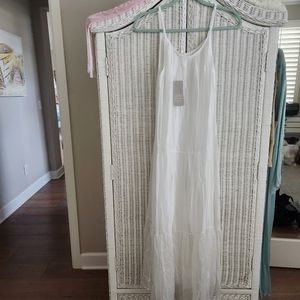 Pure Silk lined maxi dress. The layer underneath is a soft knit. Not see thru.